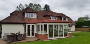 Tile Effect Roof and White UPVC Windows & Doors