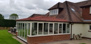 Tile Effect Roof and White UPVC Windows & Doors