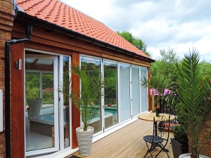White Bi-Fold Doors and Tile Effect Roof